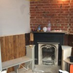 SEATING IS BUILT AROUND THE OLD FIRE PLACE